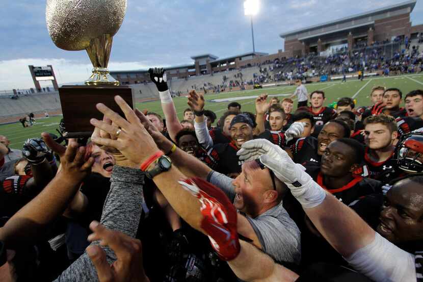 Mansfield Legacy head coach Chris Melson keeps his eyes on the prize during the trophy...