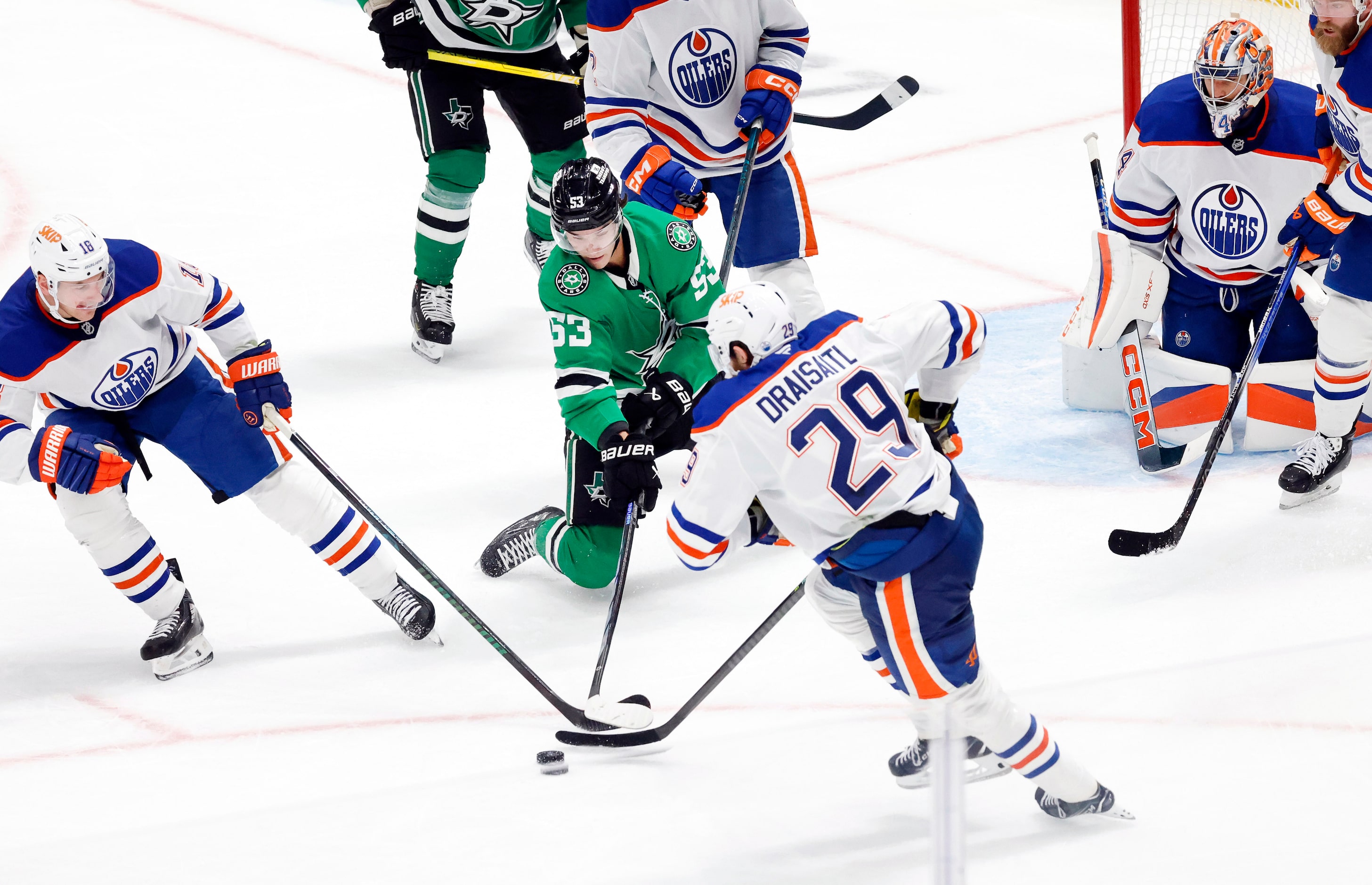 Dallas Stars center Wyatt Johnston (53) tries to coral the puck against Edmonton Oilers...