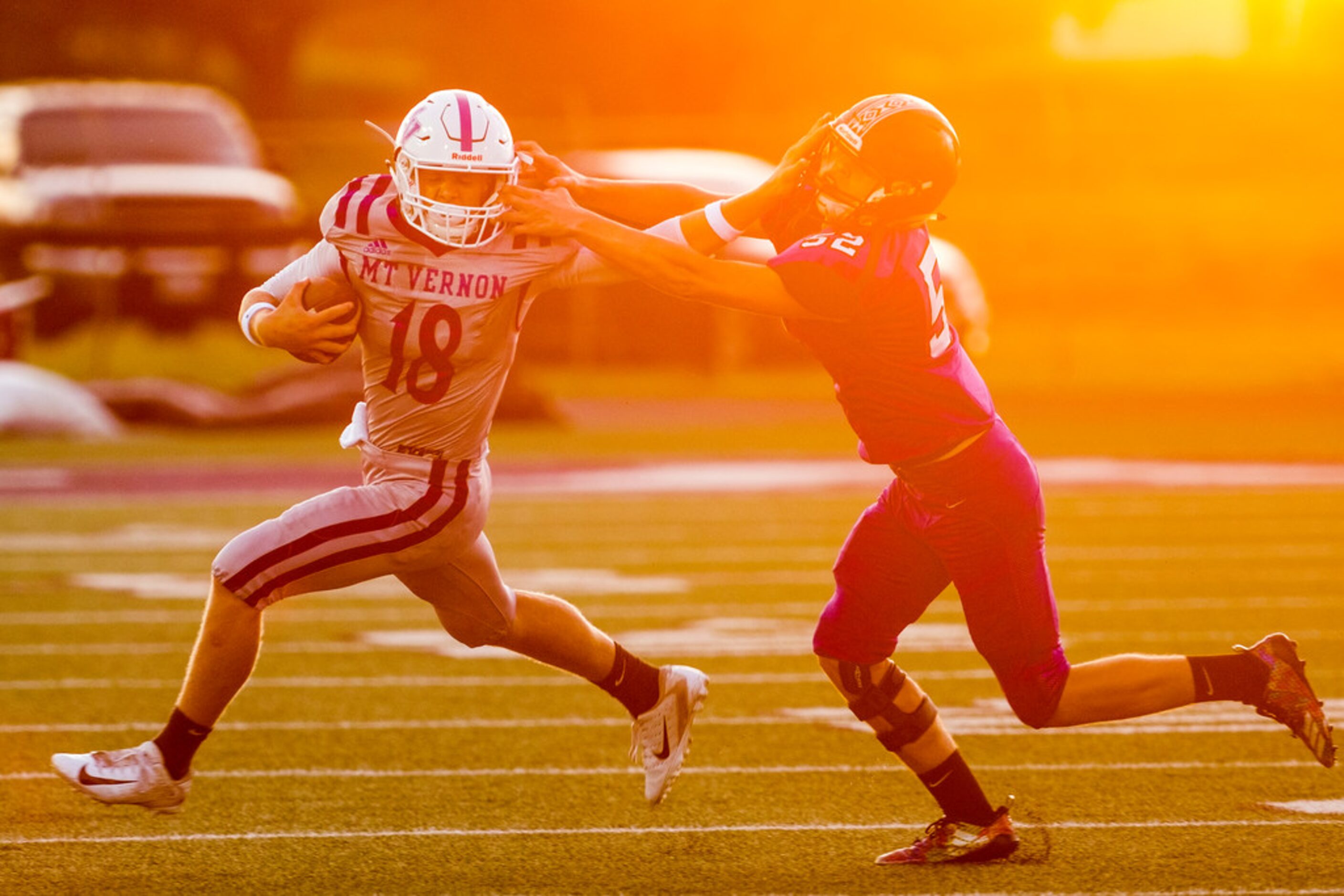 Mount VernonÃs Brock Nellor (18) tries to push away from from BonhamÃs Bryce Redmon (52)...