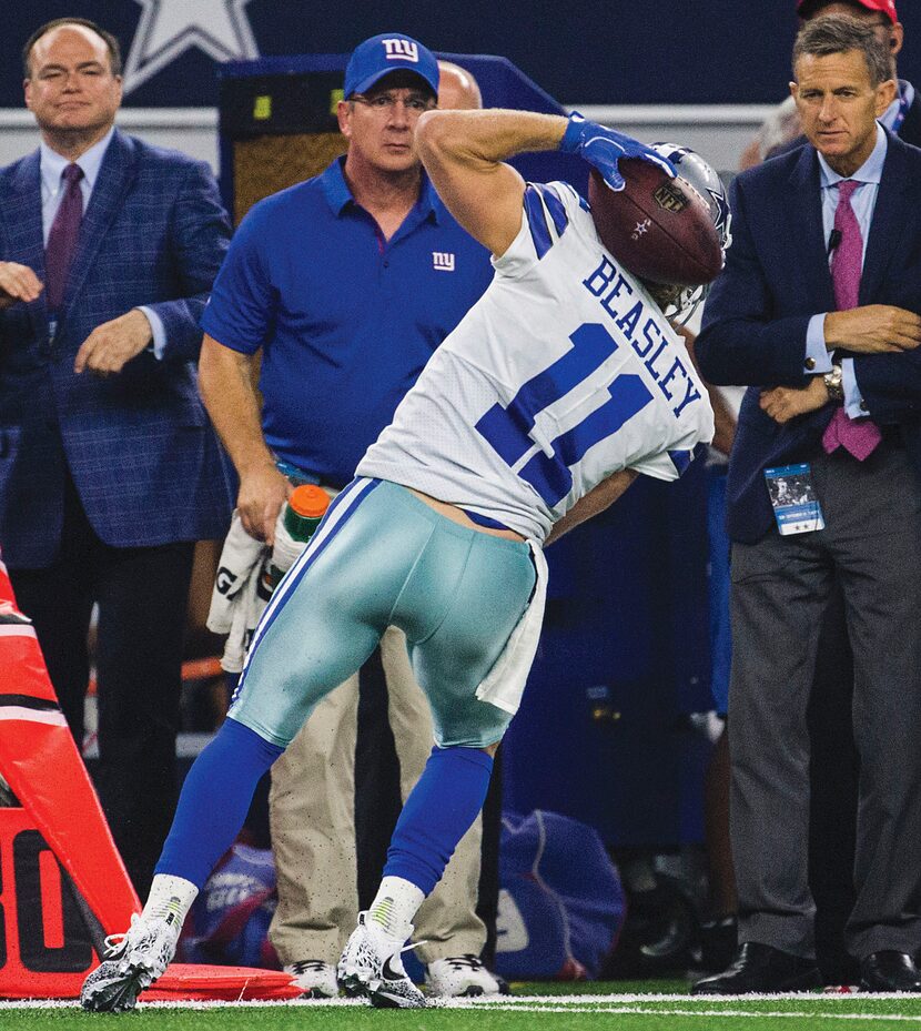 Wide receiver Cole Beasley catches a pass behind his back during the fourth quarter against...