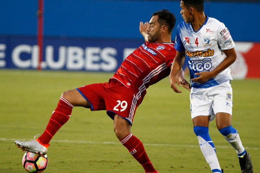 FC Dallas' Carlos Ruiz stops the ball in front of Club Deportivo Suchitepequez center back...