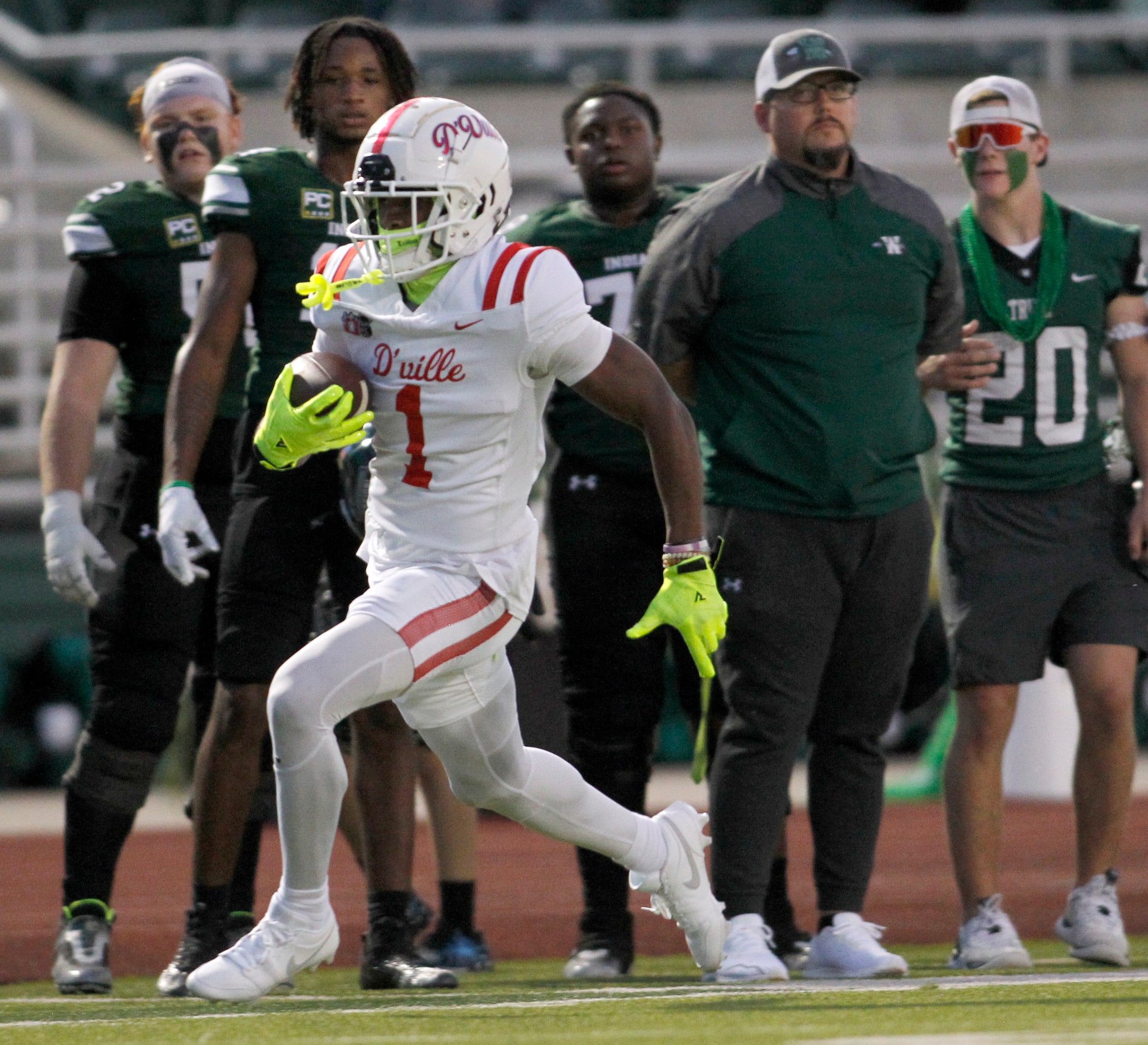 Duncanville receiver Dakorien Moore (1) sprints down the sideline as he tacks yardage onto a...