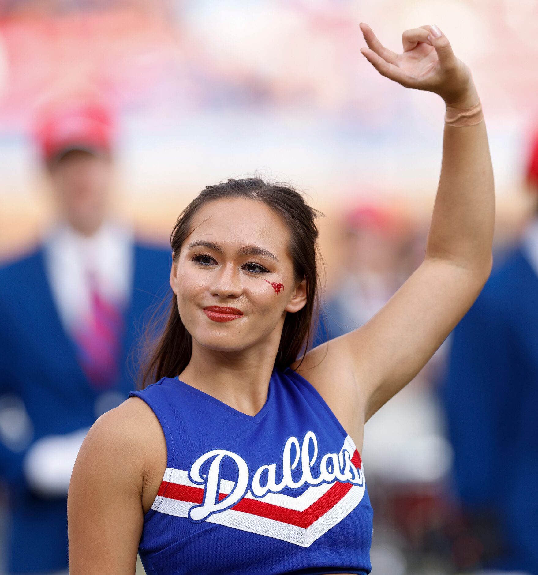 An SMU cheerleader holds up the "pony up" sign before the first half of an NCAA football...