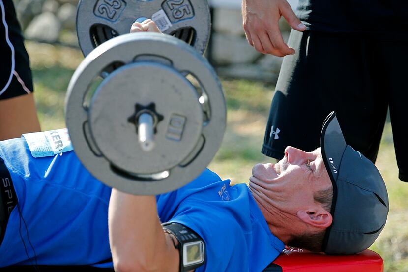 Chris Prince, of McKinney, bench presses 80 percent of his body weight after running the 5K...