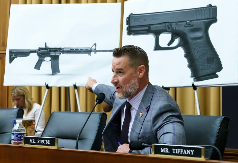 Rep. Greg Steube, R-Fla., compares different models of firearms as the House Judiciary...