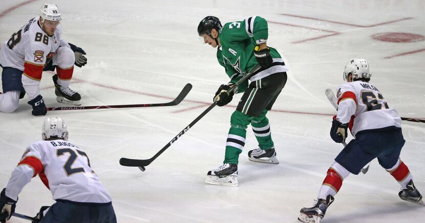 Stars defenseman John Klingberg (3) skates into the Florida Panthers defense during a game...