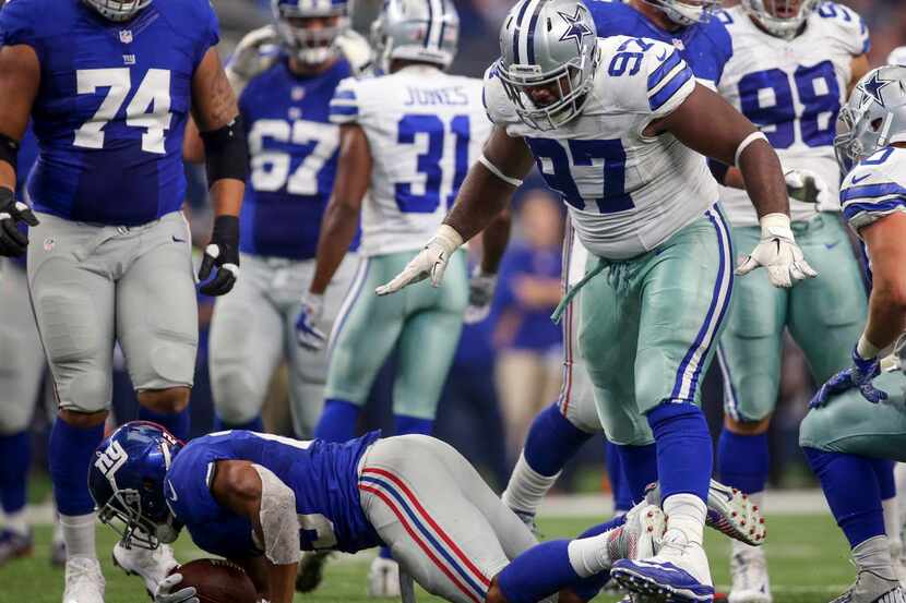 Dallas Cowboys defensive tackle Terrell McClain (97) gestures after stopping New York Giants...