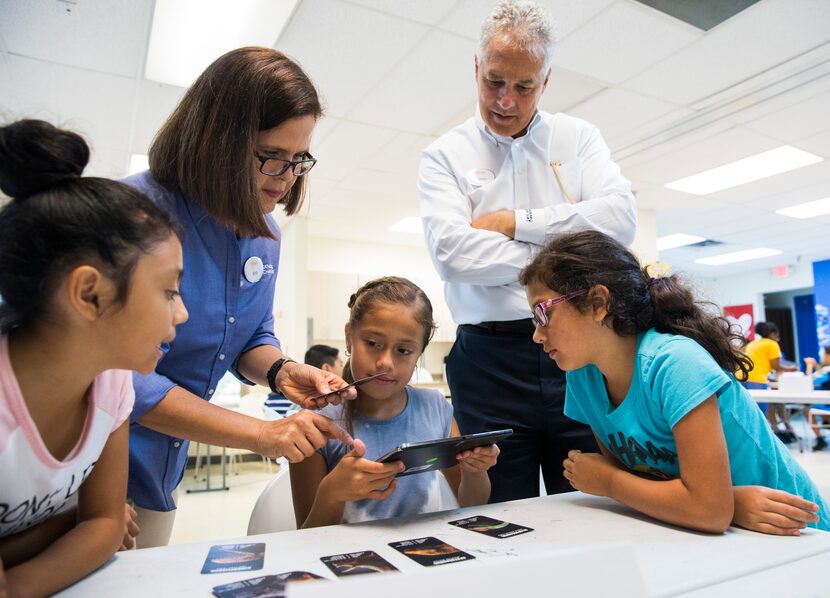 Educational programs manager Ana Maria Schaller, second from left, and CEO Dave Woodyard,...