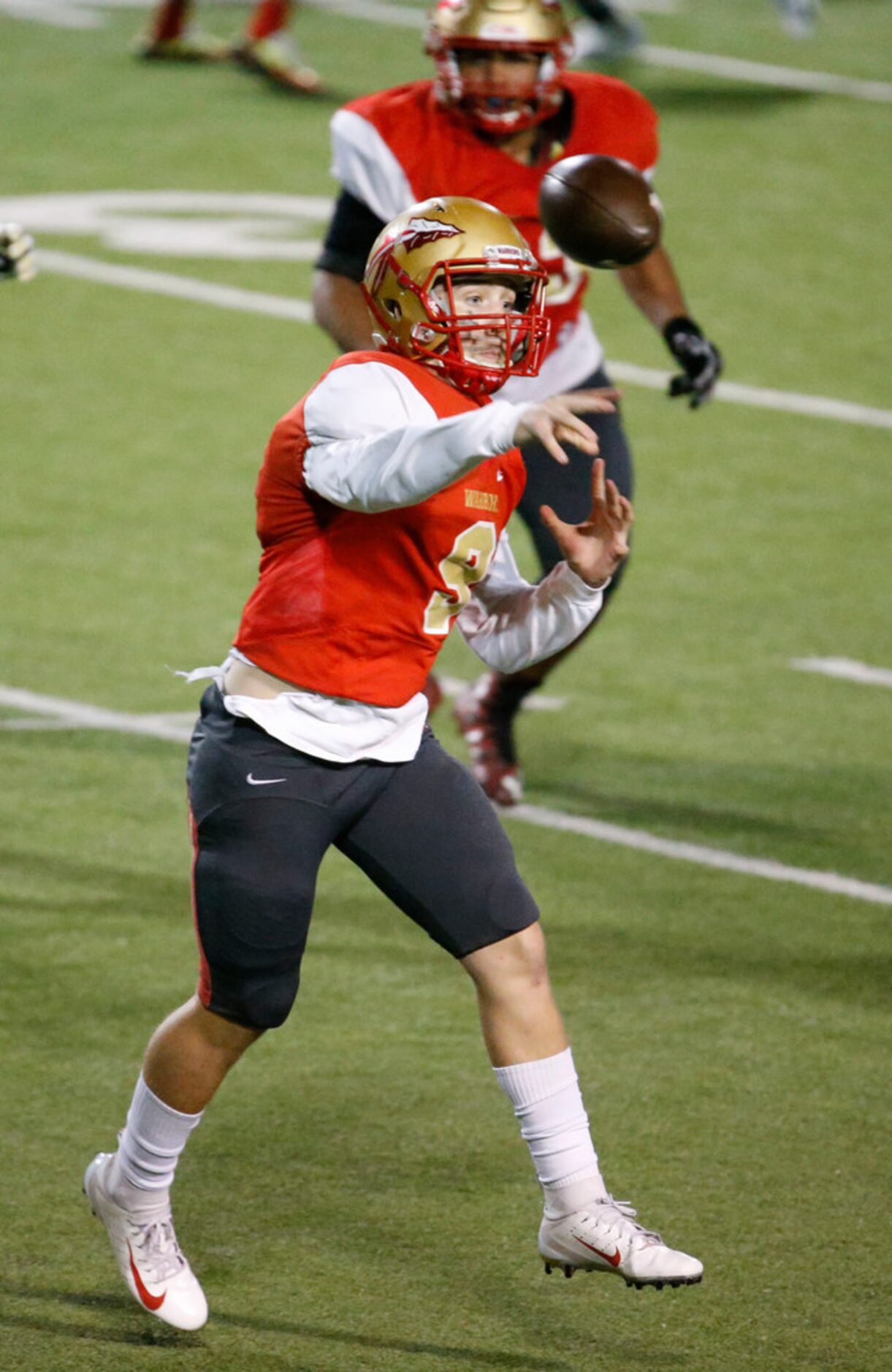 South Grand Prairie's Drake Logan (9) passes the ball against Desoto during the second half...