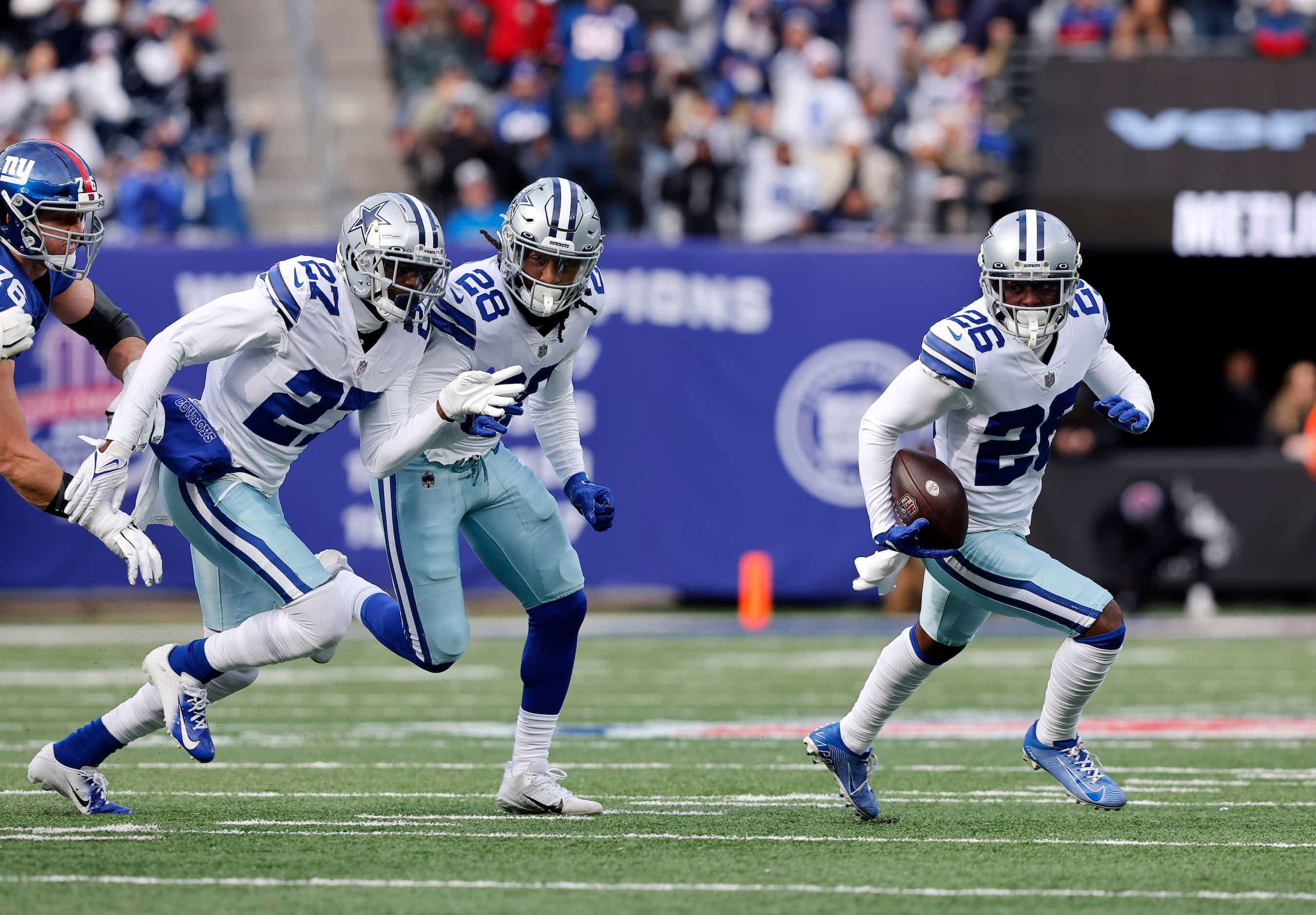 Dallas Cowboys cornerback Jourdan Lewis (26) returns a first quarter interception with...