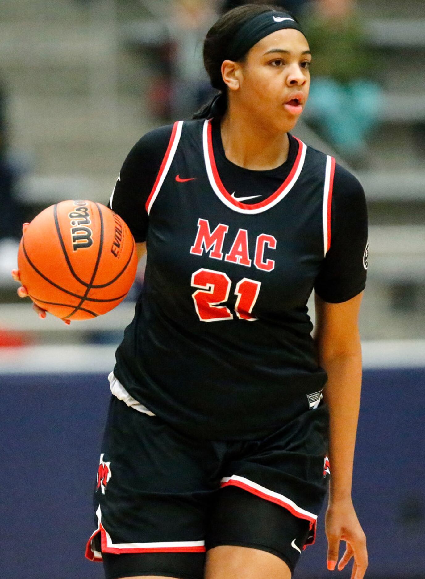 Irving MacArthur High School post Hannah Gusters (21) brings the ball up the floor during...