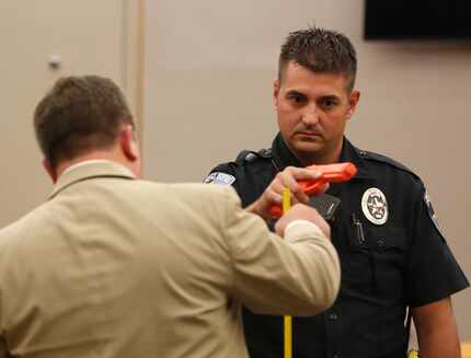 Defense attorney Miles Brissette (left) questions Balch Springs police officer Tyler Gross.