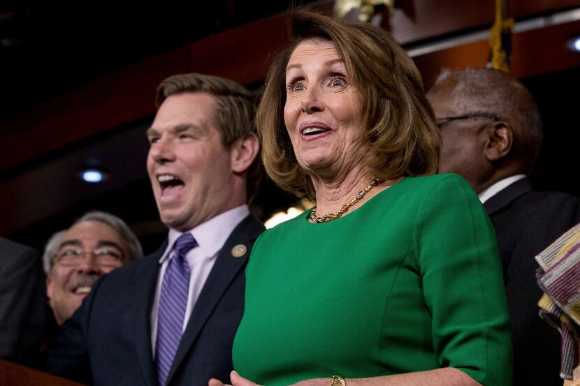House Minority Leader Nancy Pelosi of Calif., right, accompanied by Rep. G. K. Butterfield,...