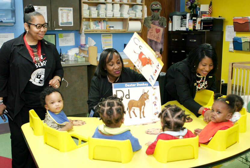 University of Dreams administrators Shunta Hunter (far left) and Sherrye Vaden (far right),...