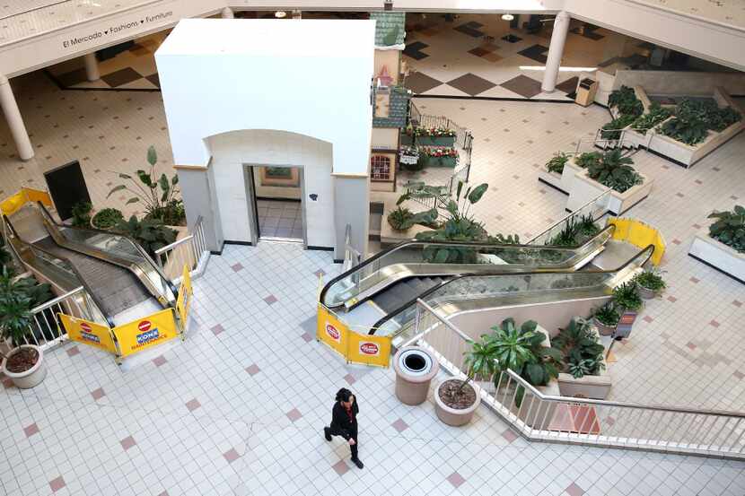 A woman walks across the interior of Valley View Mall in Dallas on Wednesday, Feb. 1, 2017. 