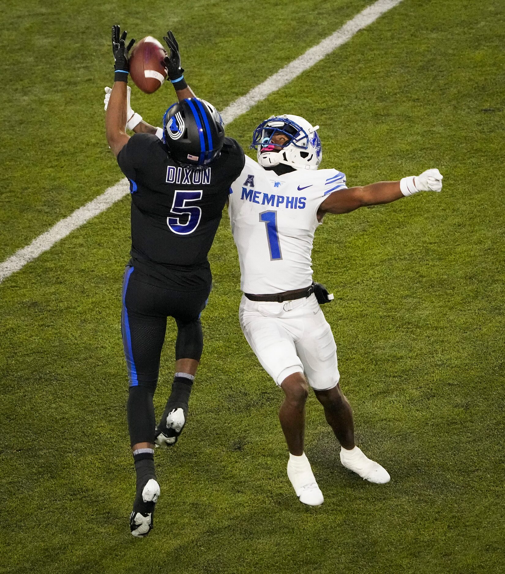 SMU wide receiver Moochie Dixon (5) catches a pass as Memphis defensive back Davion Ross (1)...