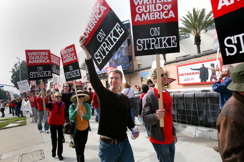 FILE -- Members of the Writers Guild of America picket during their last strike in front of...