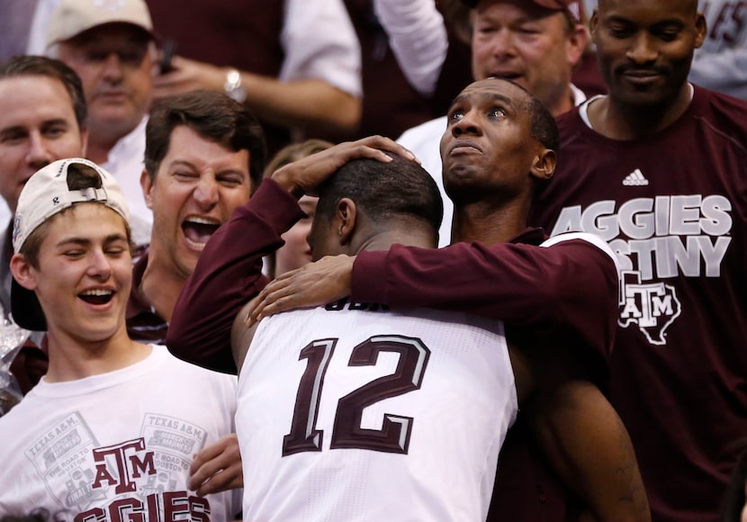 Texas A&M Aggies guard Jalen Jones (12) hugs his father, Reginald Jones, after defeating...