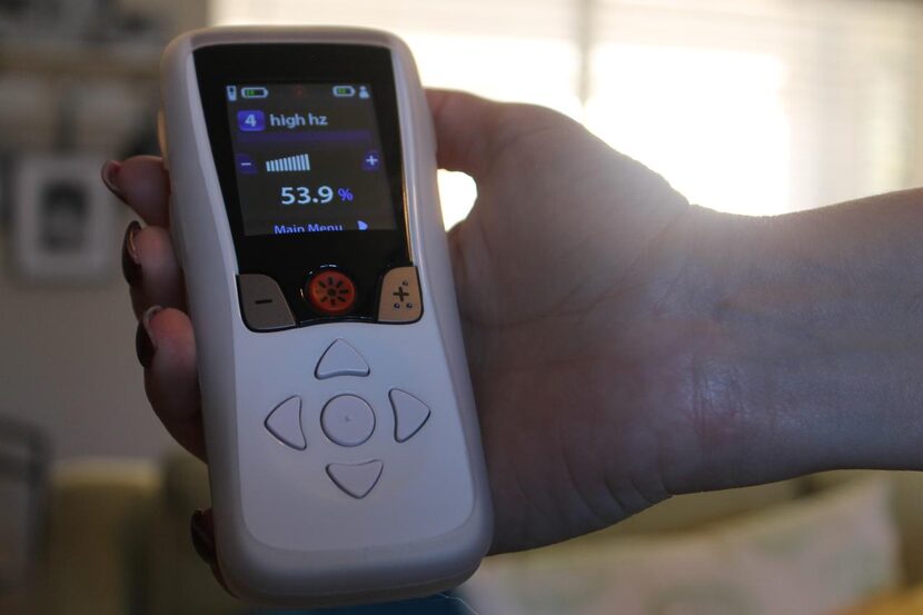 
Trina Poteet holds the remote to control her Boston Scientific stimulator. She can change...