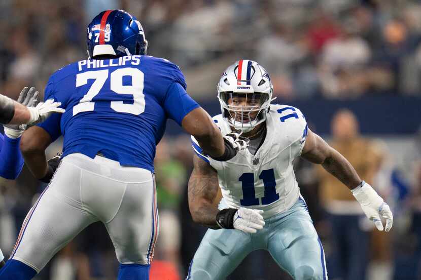 Dallas Cowboys linebacker Micah Parsons (11) rushes in as New York Giants offensive tackle...