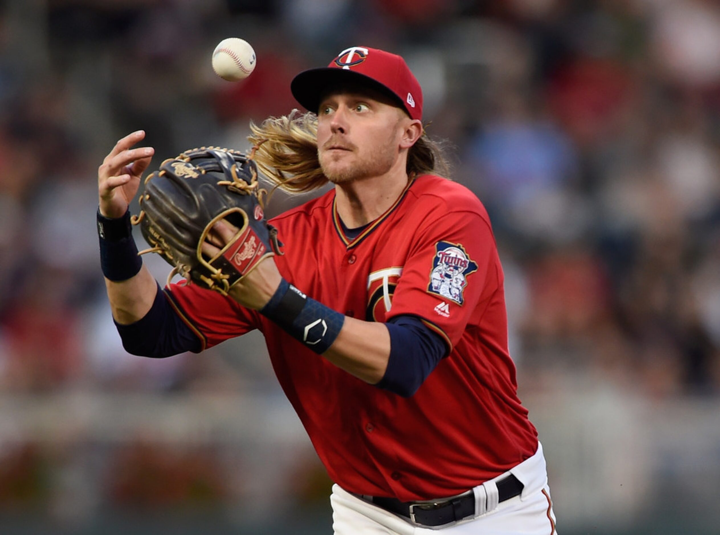 MINNEAPOLIS, MN - JUNE 22: Taylor Motter #45 of the Minnesota Twins bobbles a ball hit by...