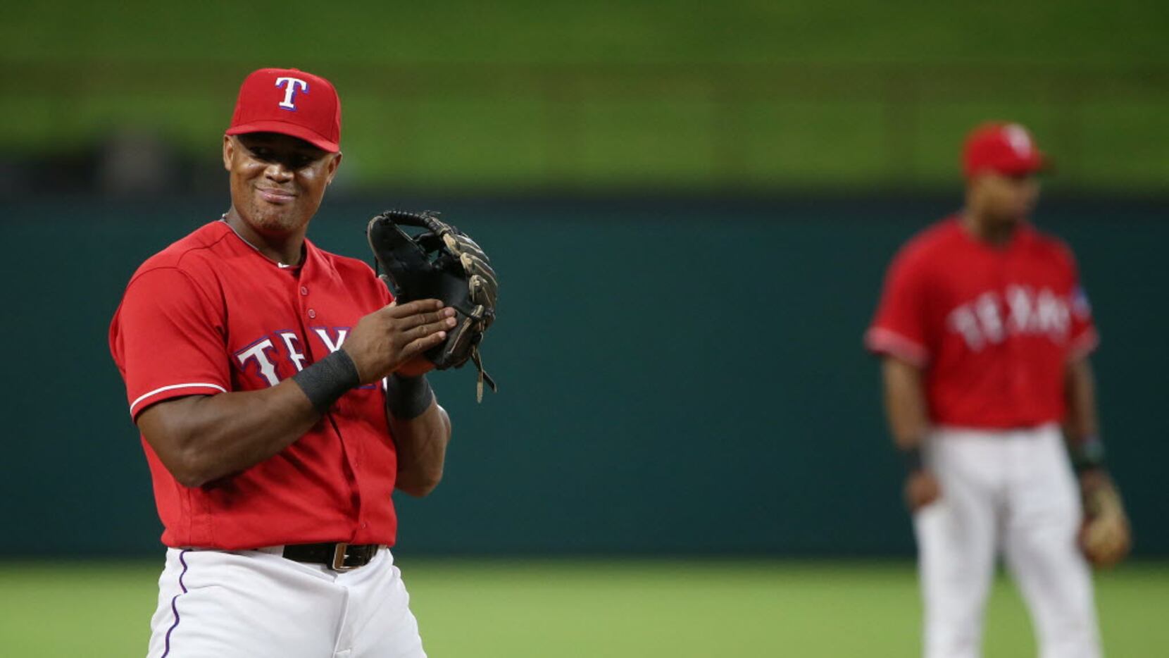 Texas Rangers third baseman Adrian Beltre (29) looks toward to the Oakland Athletics dugout...