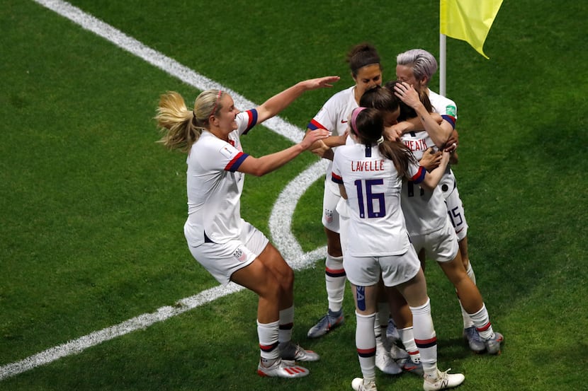 US players celebrate after teammate Tobin Heath scored their side's second goal during the...