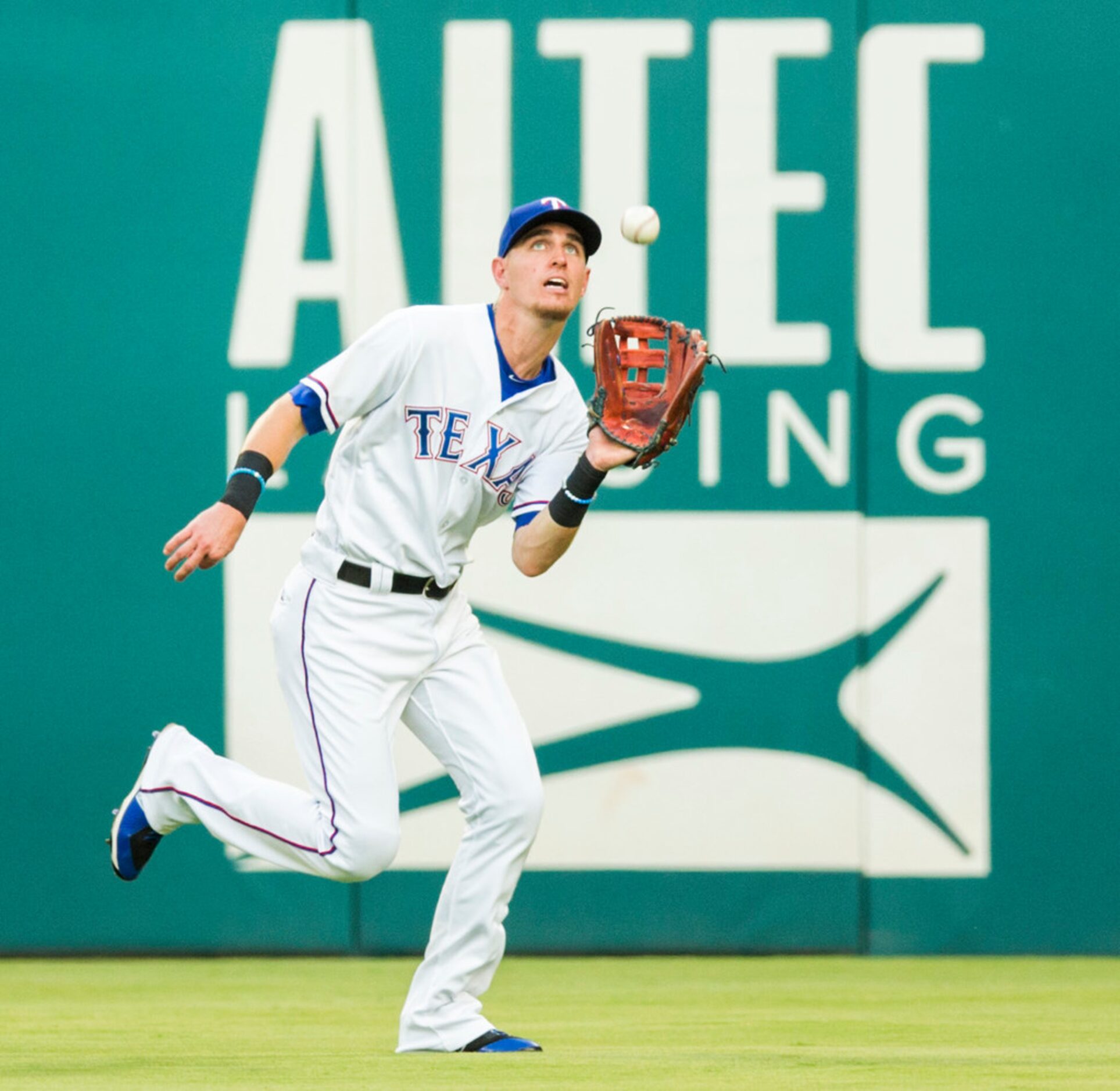 Texas Rangers center fielder Carlos Tocci (15) catches a fly ball in center field hit by...