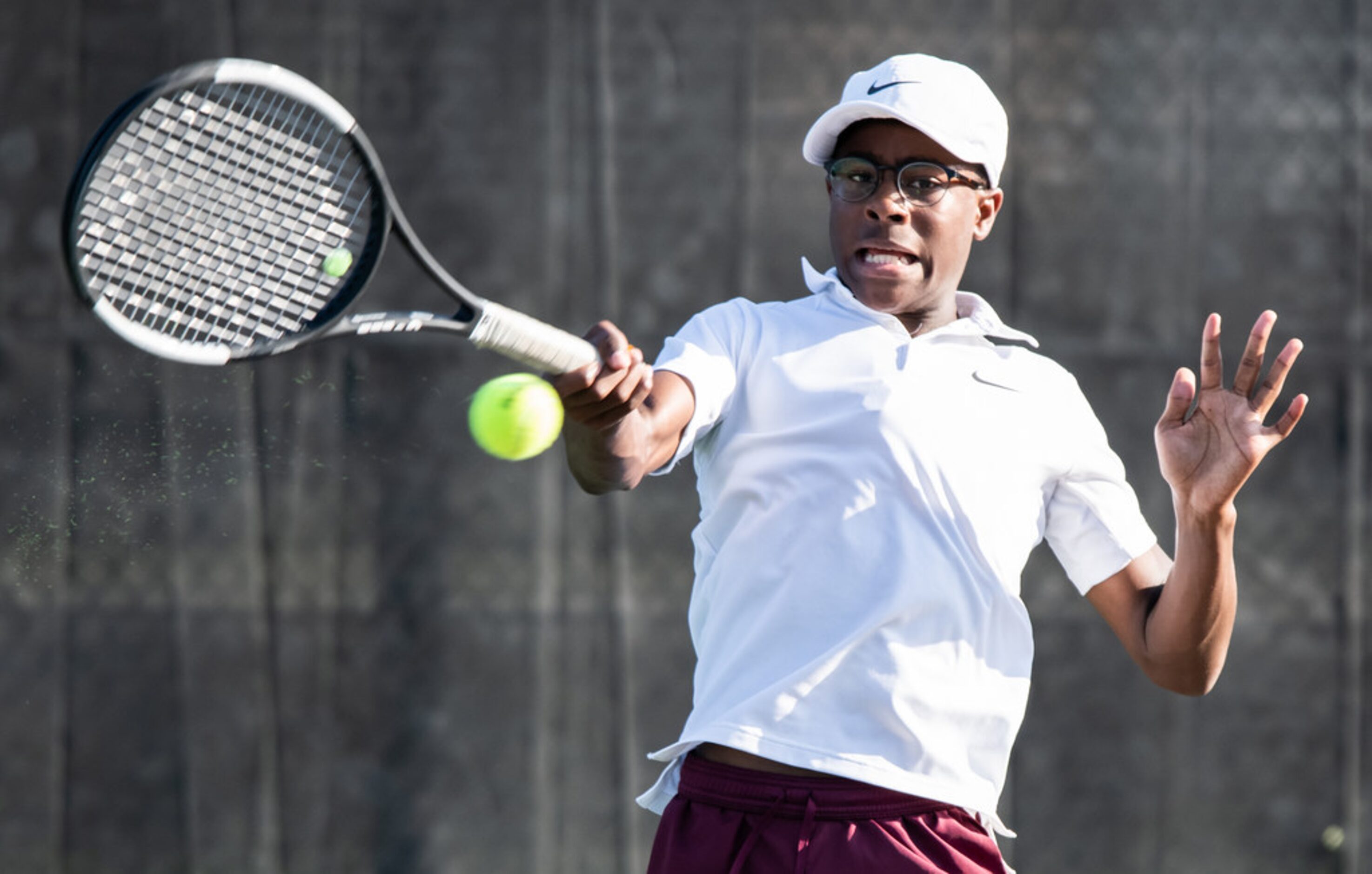 Red Oak's Jerod Wilson returns the ball in a singles match against Northside Harlan's Landon...