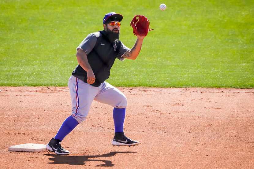Texas Rangers infielder Rougned Odor works as second base during a spring training workout...