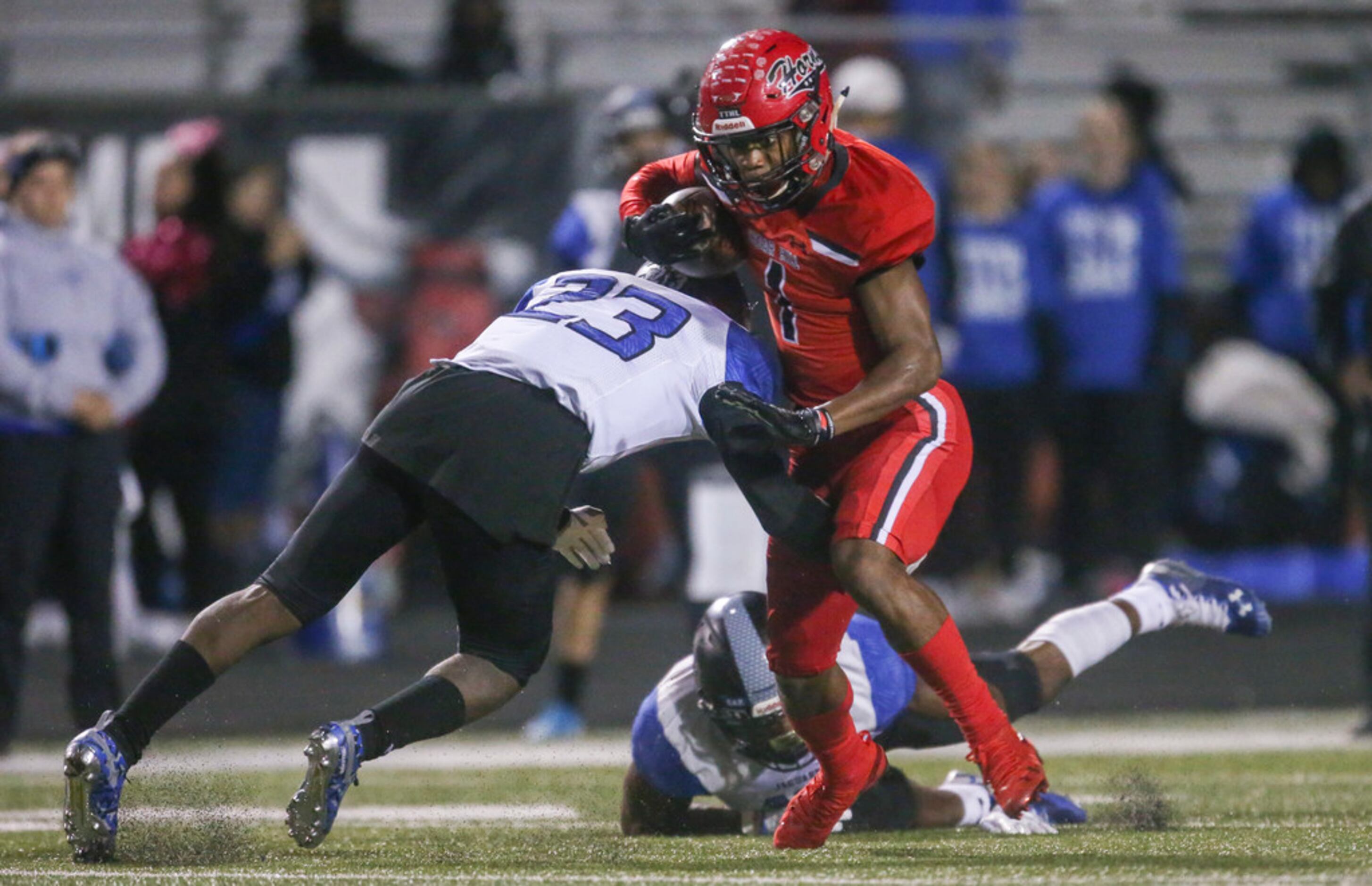 Cedar Hill wide receiver Quin Bright (1) carries the ball past Mansfield Summit player...