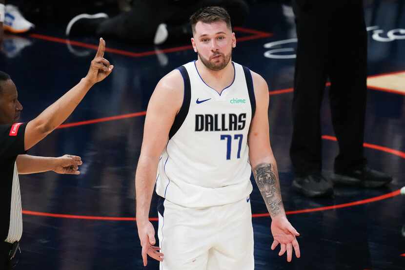 Dallas Mavericks guard Luka Doncic (77) reacts while talking with a referee during the...