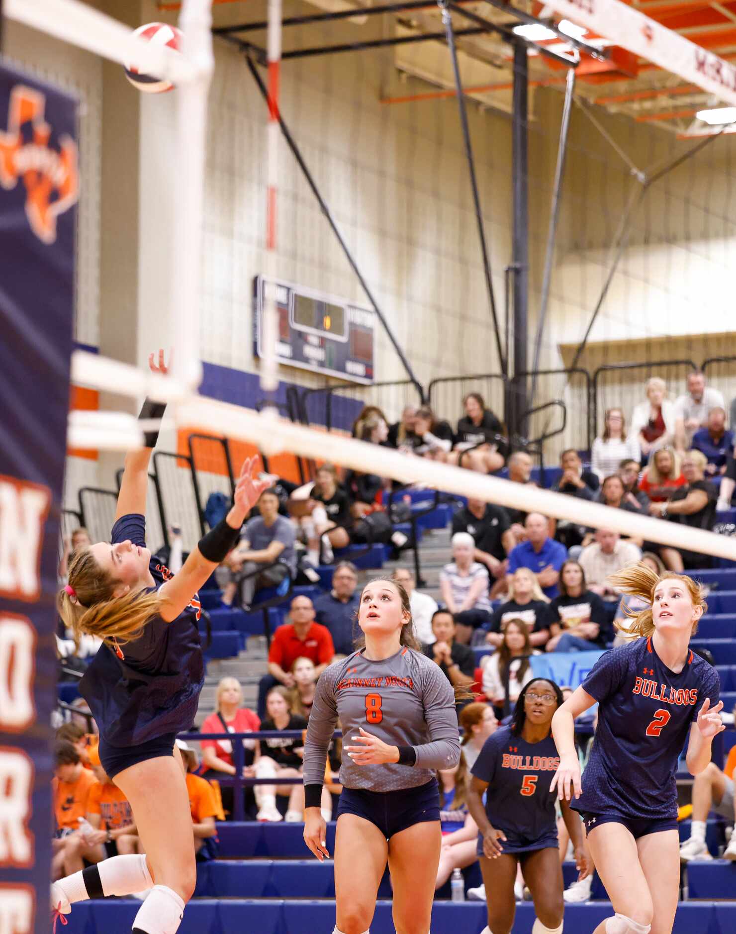 McKinney North Lily Nicholson (12) dives for the ball in the final set of a match against...