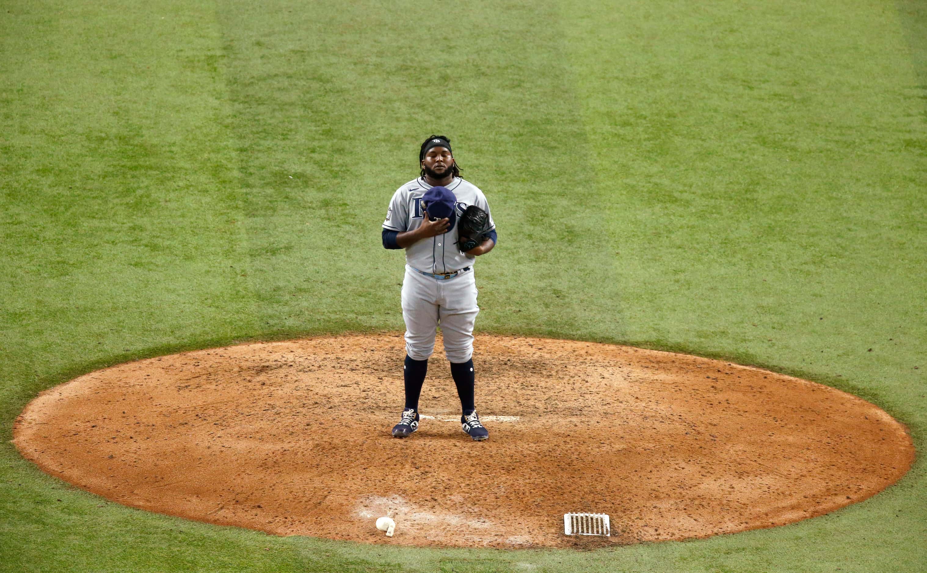 Tampa Bay Rays relief pitcher Diego Castillo (63) takes a moment before pitching to Los...