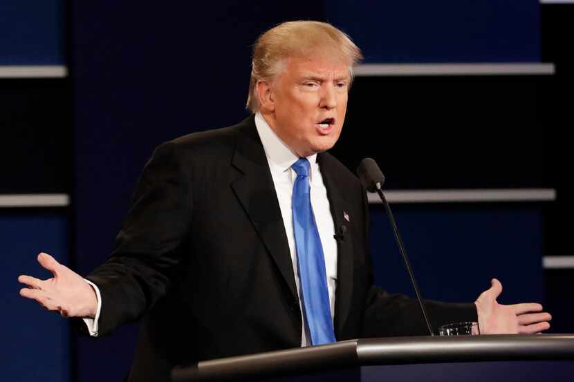 Republican presidential nominee Donald Trump answers a question during the presidential...