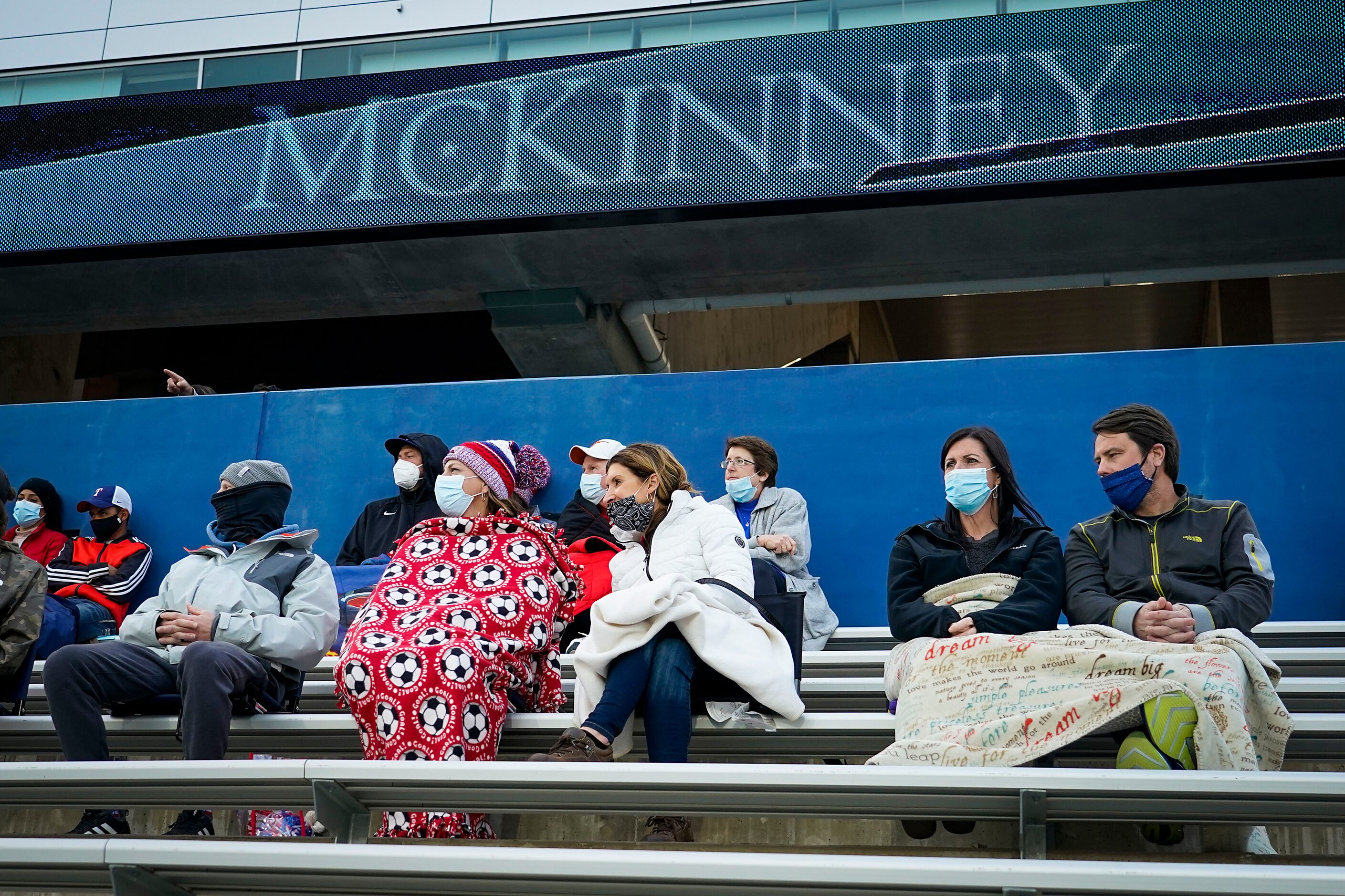 McKinney Boyd fans bundle up as they watch during a Class 6A Region I quarterfinal boys high...