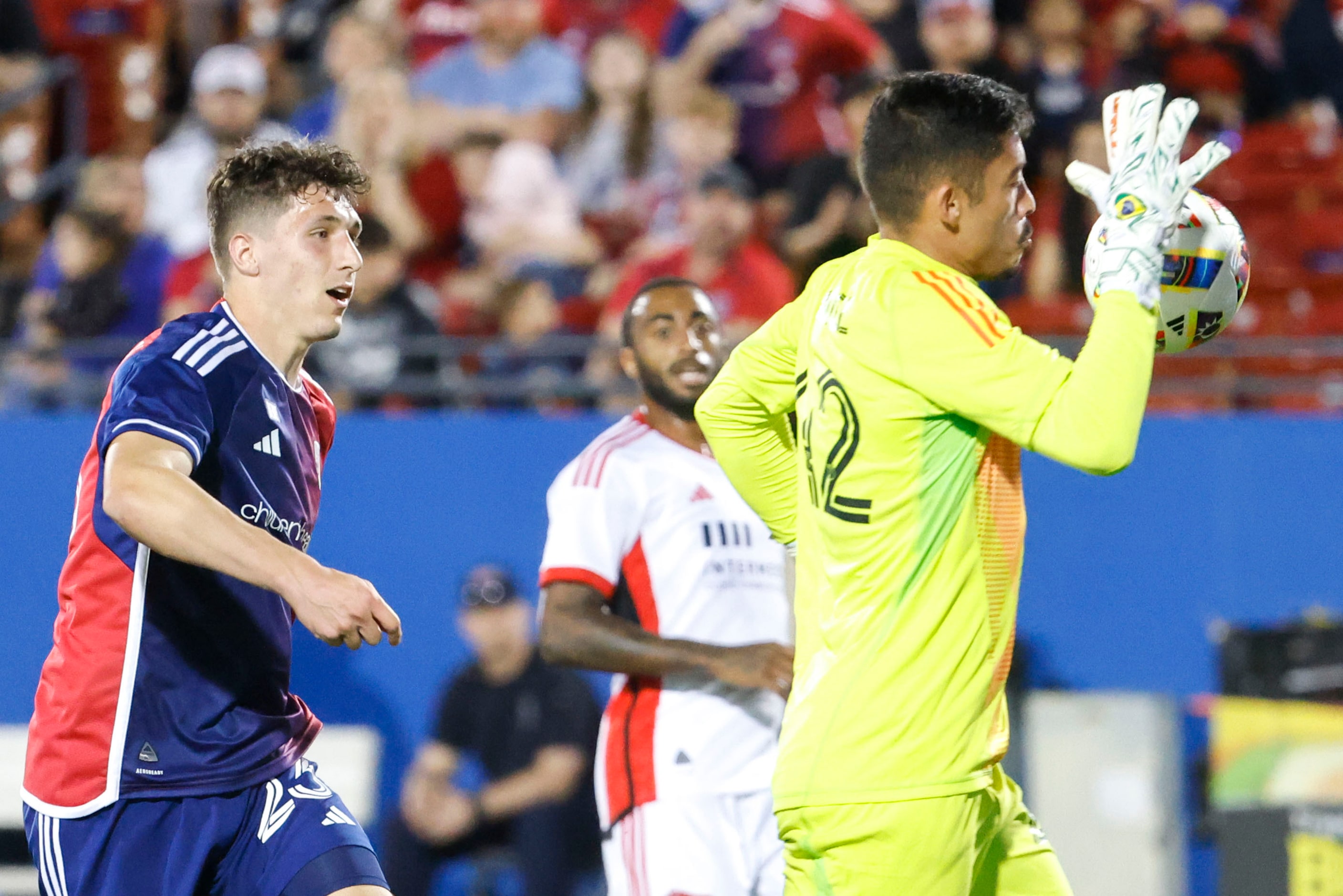 FC Dallas’ Logan Farrington (left) shoots as San Jose goalkeeper Daniel blocks during the...