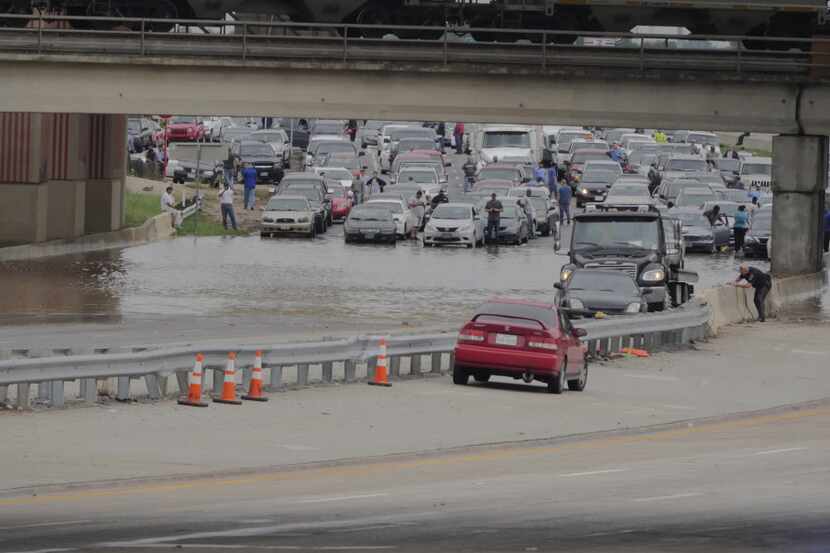  Southbound Loop 12 motorists are stranded by the high water under I-30 Friday, May 29,...