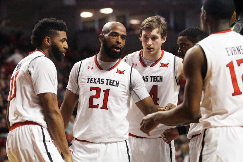 Texas Tech forward Anthony Livingston rallies his teammates during the second period of an...