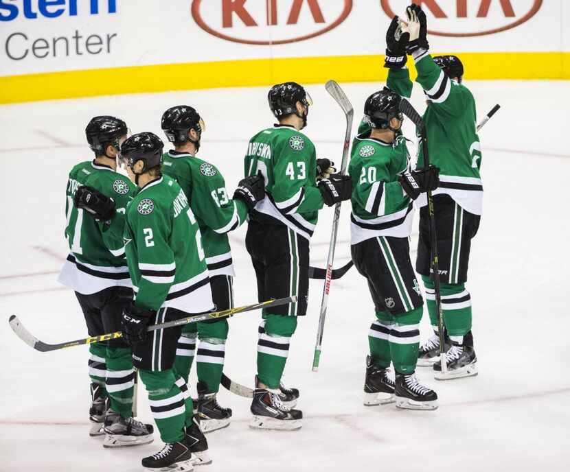 Dallas Stars celebrate a 4-0 win over the Chicago Blackhawks after their game on Tuesday,...