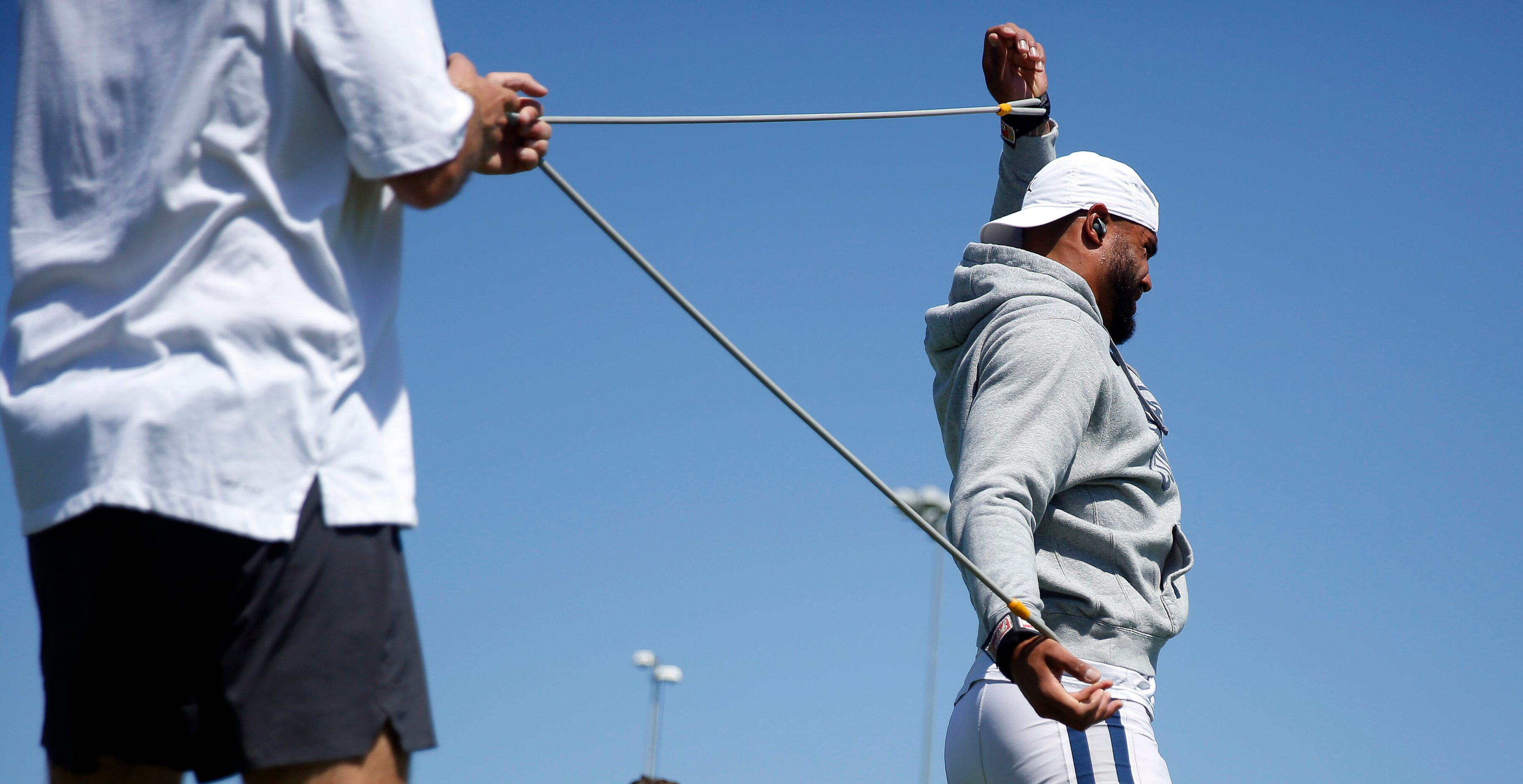 Dallas Cowboys quarterback Dak Prescott stretches before a joint practice with the Los...