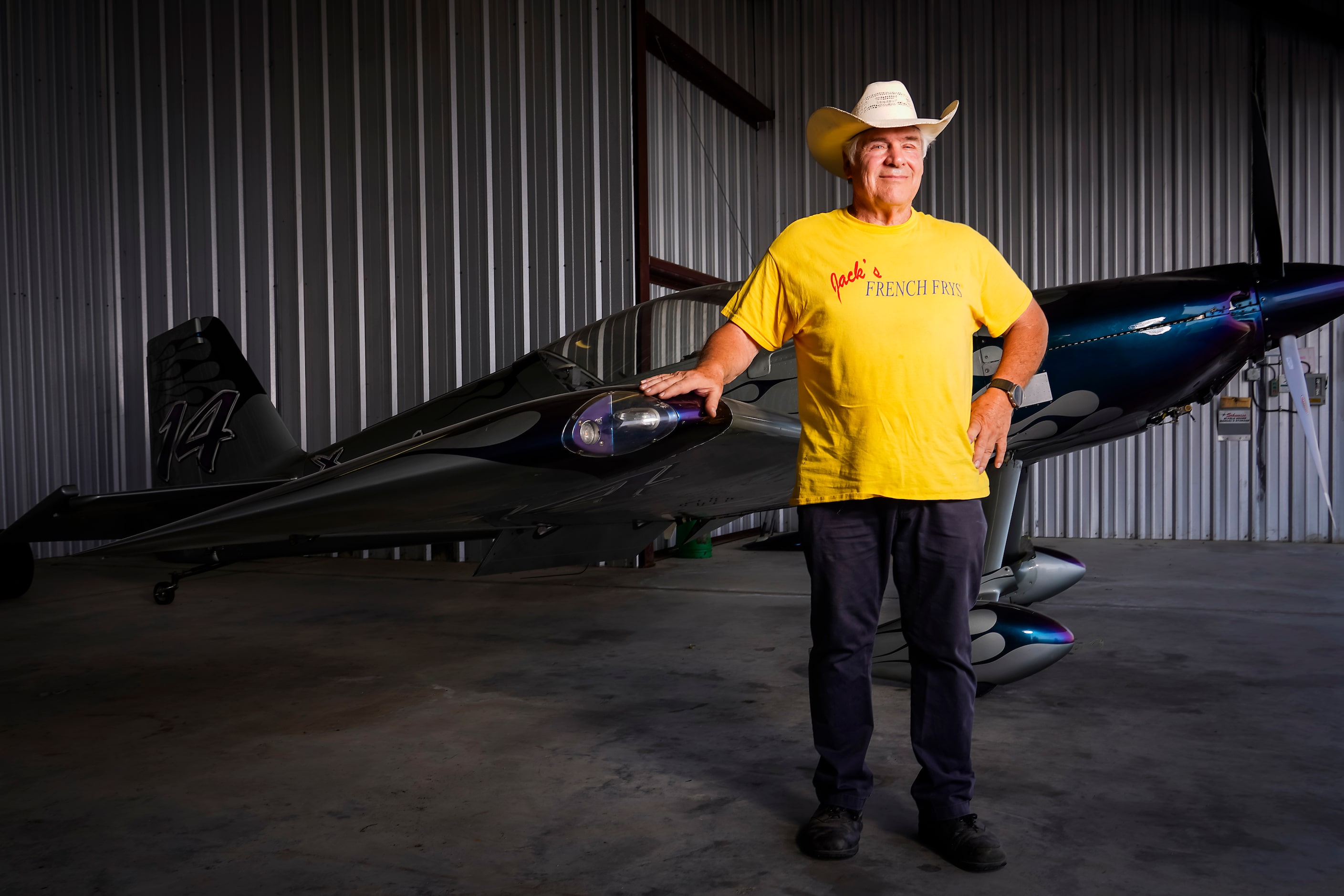 Jack Pyland is photographed with one of his aircraft in a hangar at Lancaster Regional...