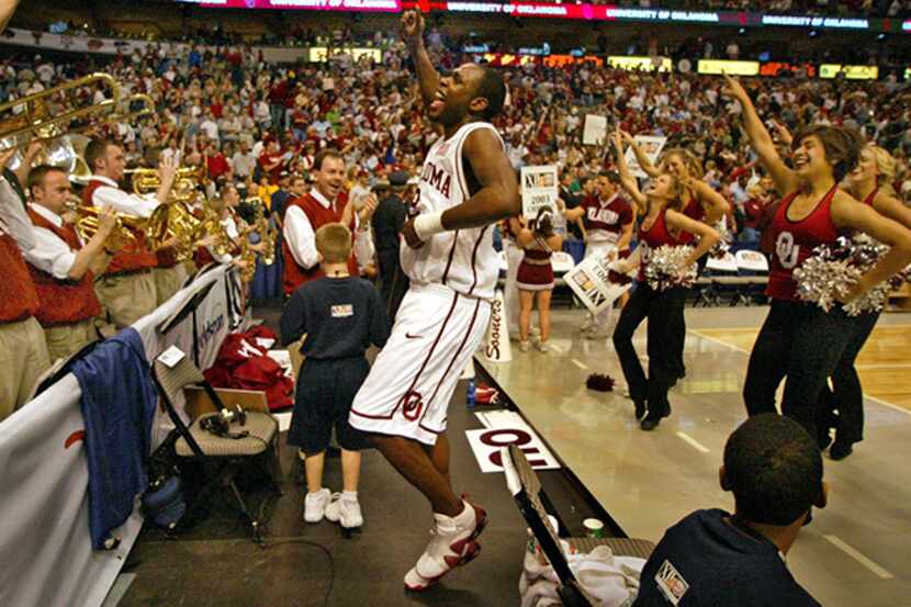  MarchÂ 16, 2003 -- Oklahoma's Ebe Ere (2) dances with the OU pom squad asÂ the Sooner band...