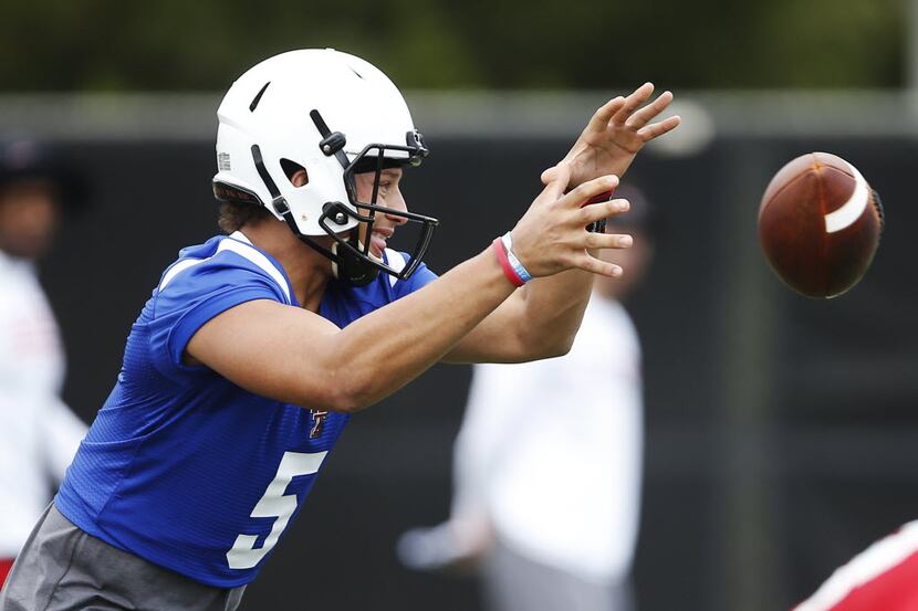 Texas Tech's Pat Mahomes catches a snap during the first day of fall NCAA football camp...