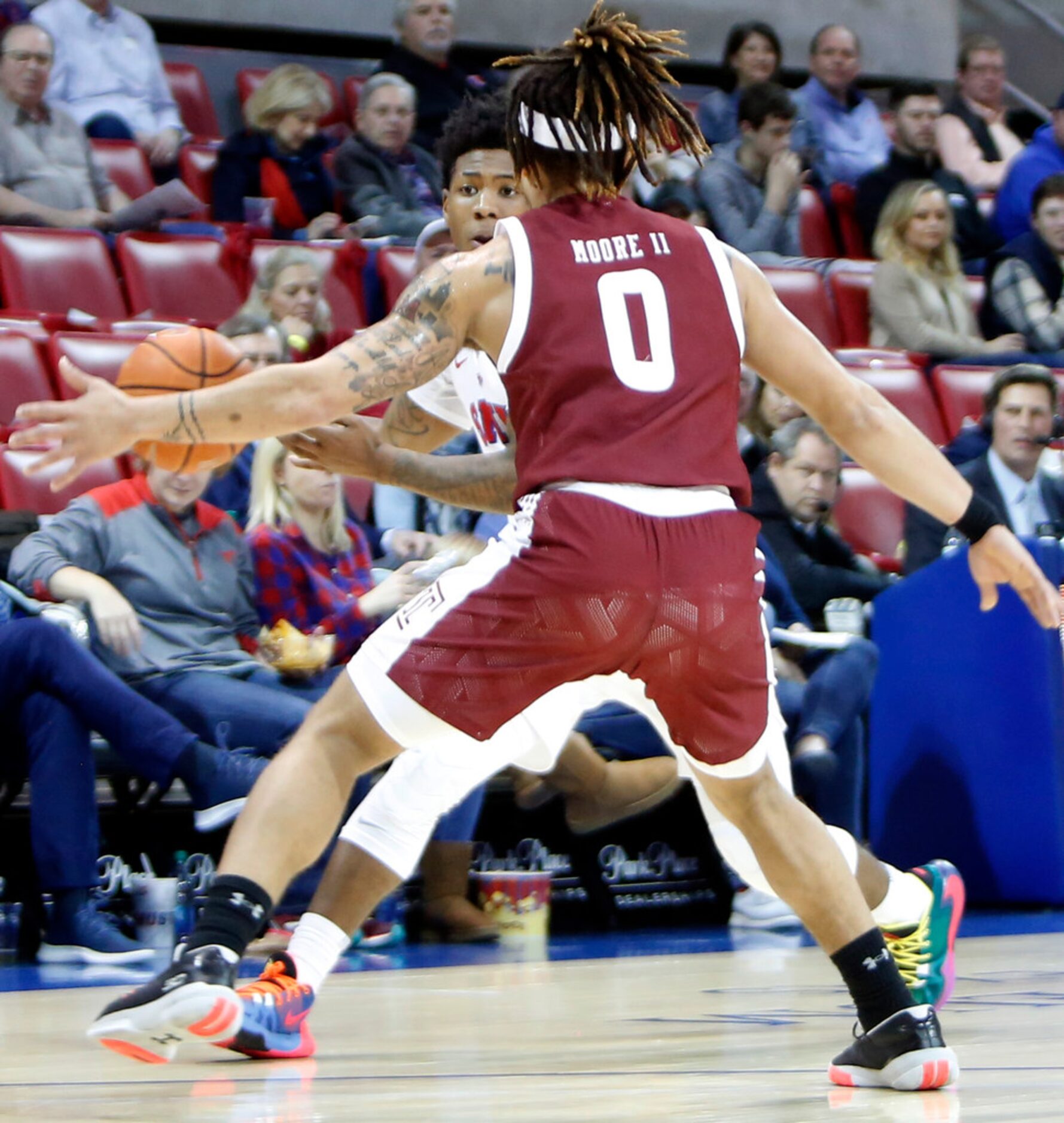 SMU guard Kendric Davis (3) looks for an open teammate as he is defended by Temple guard...