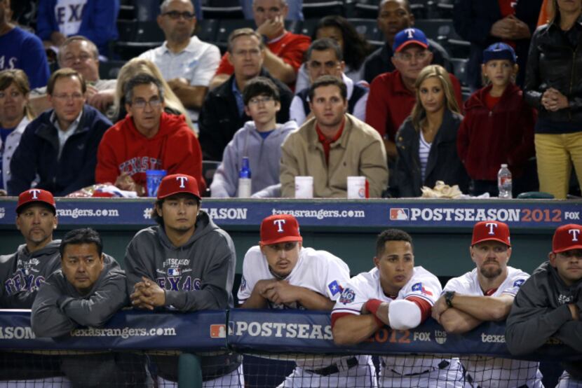 Texas Rangers manager Ron Washington, front right, greets Adrian