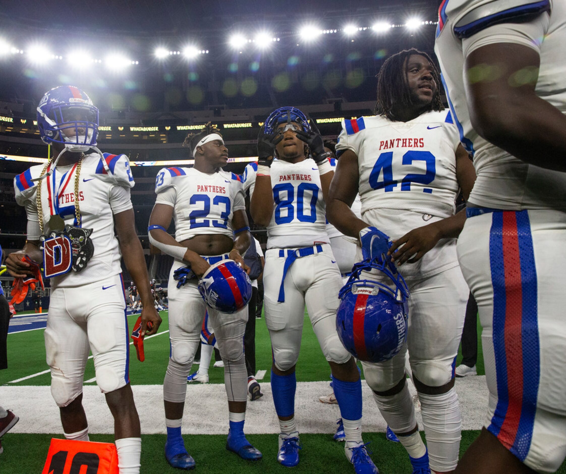 Duncanville players sing their alma mater song after defeating Flower Mound 59-13 in the...