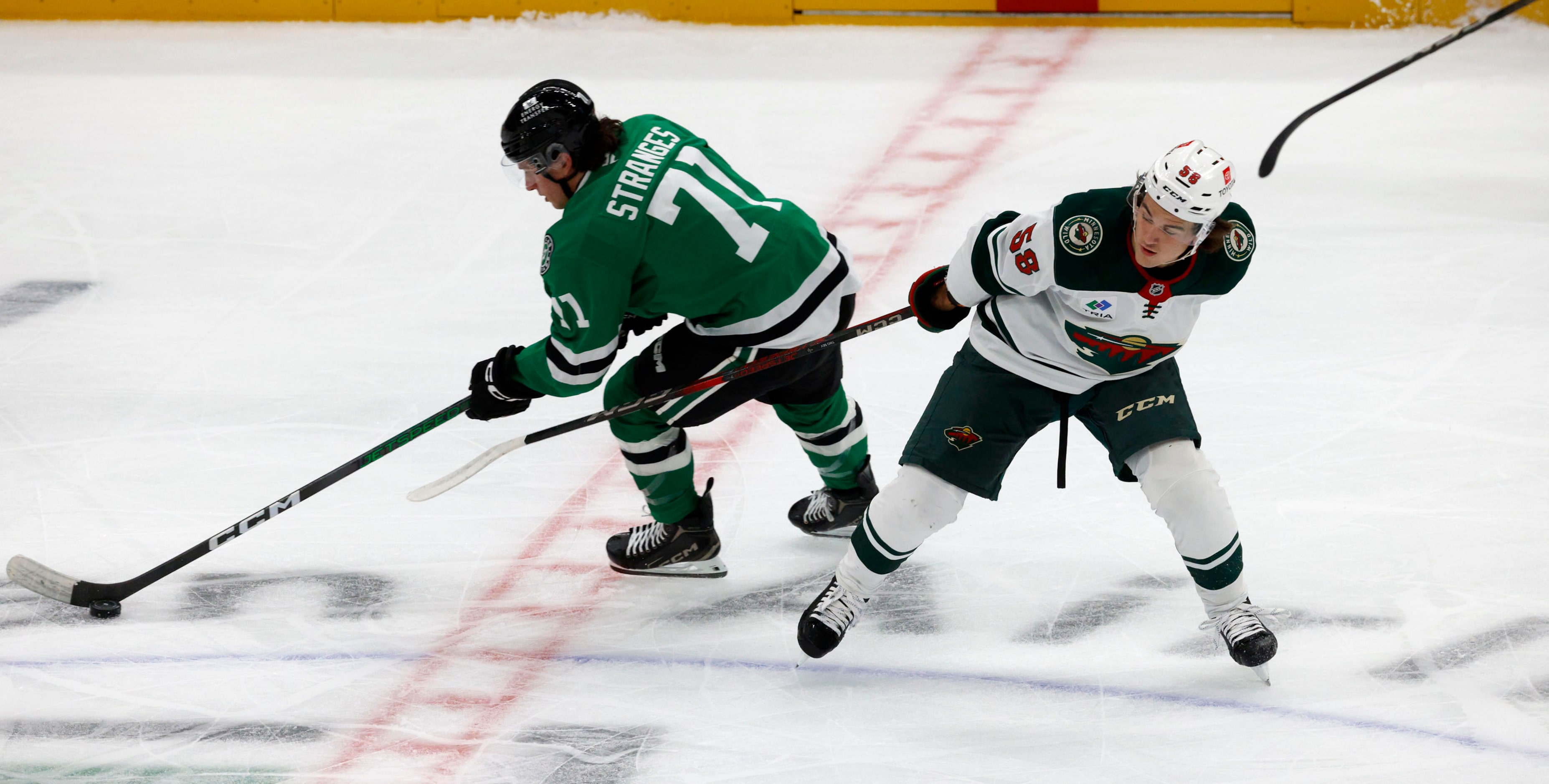 Dallas Stars left wing Antonio Stranges (71) controls the puck against Minnesota Wild...