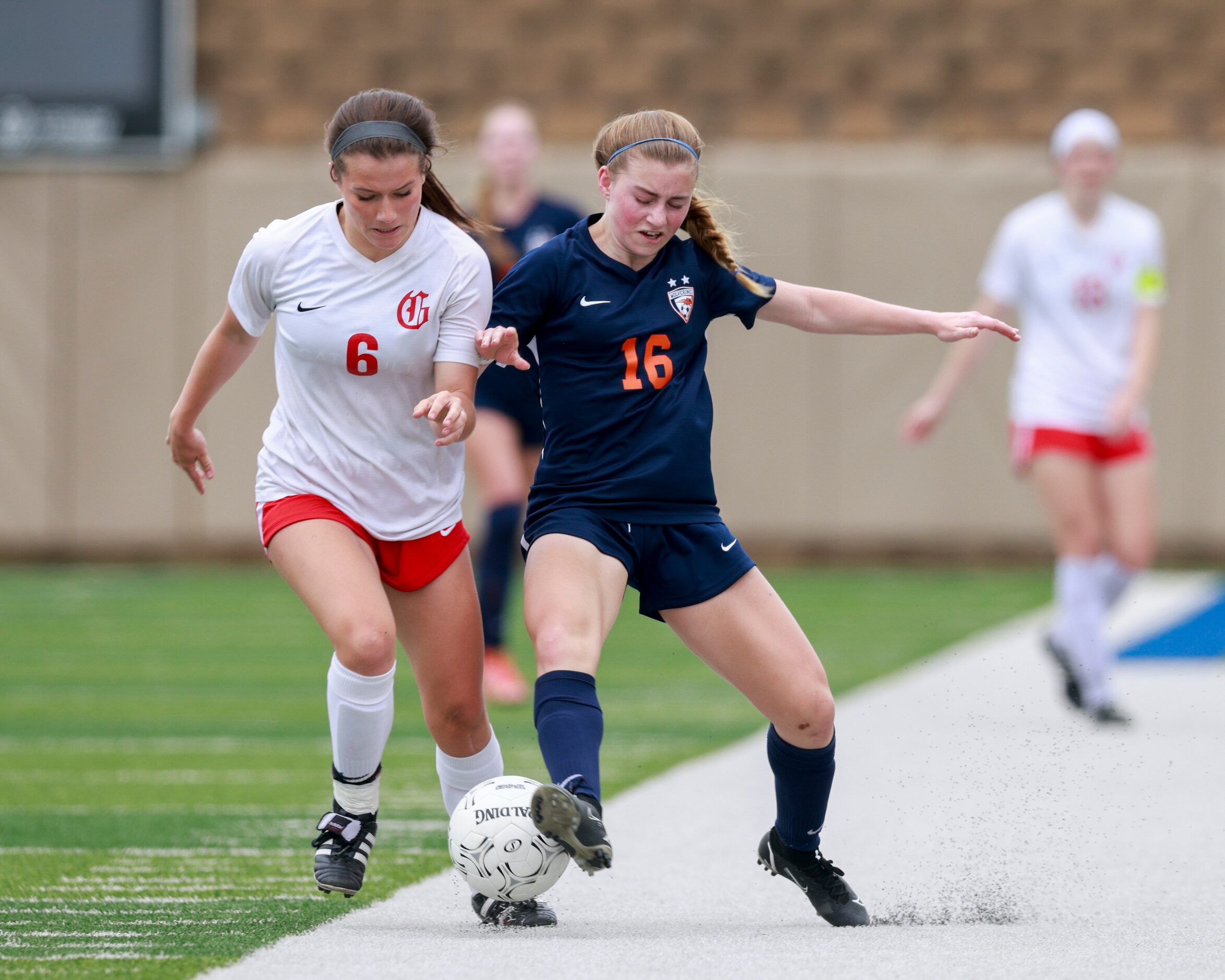 Frisco Wakeland forward Dayleigh Bos (16) and Grapevine defender Samantha Lumpkin (6) battle...