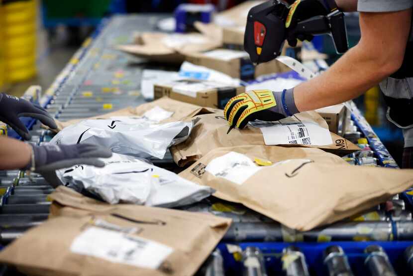 Some 172,000 packages will move through Amazon's Lewisville delivery station during the...